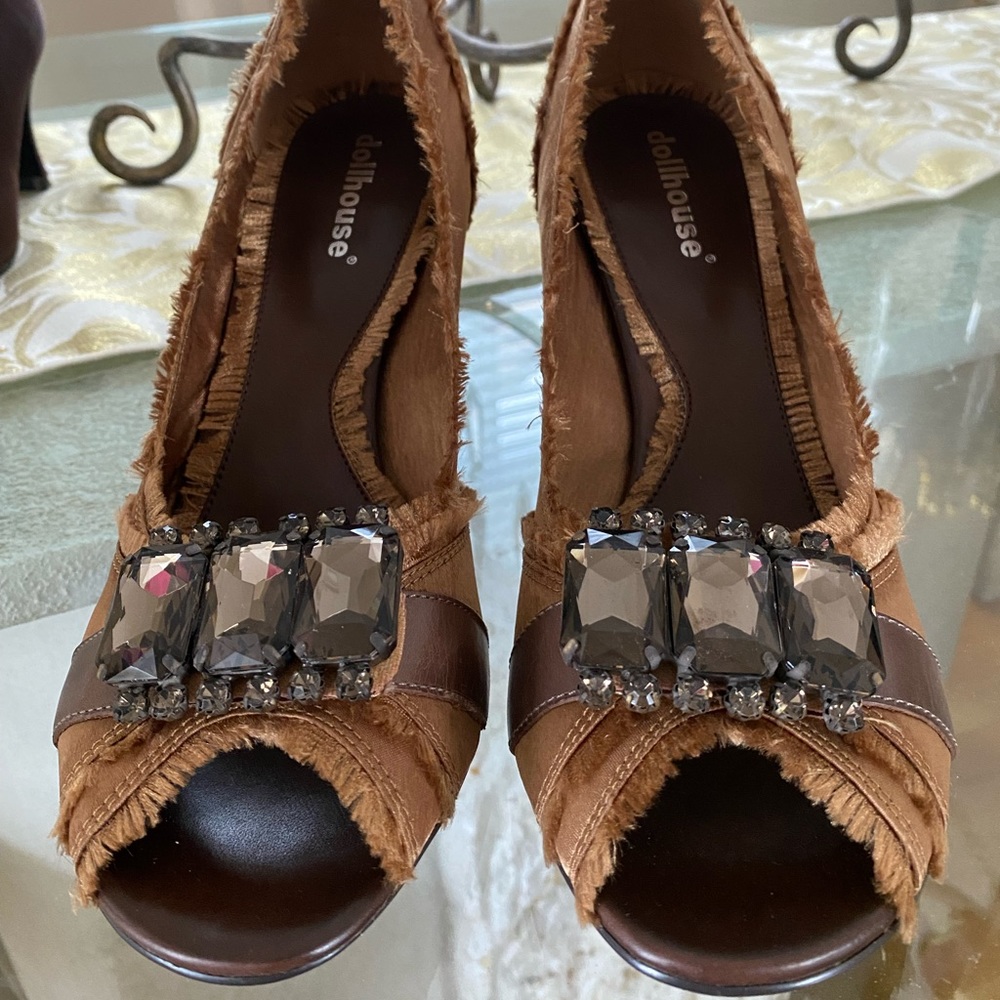 Gold satin shoes with stones.